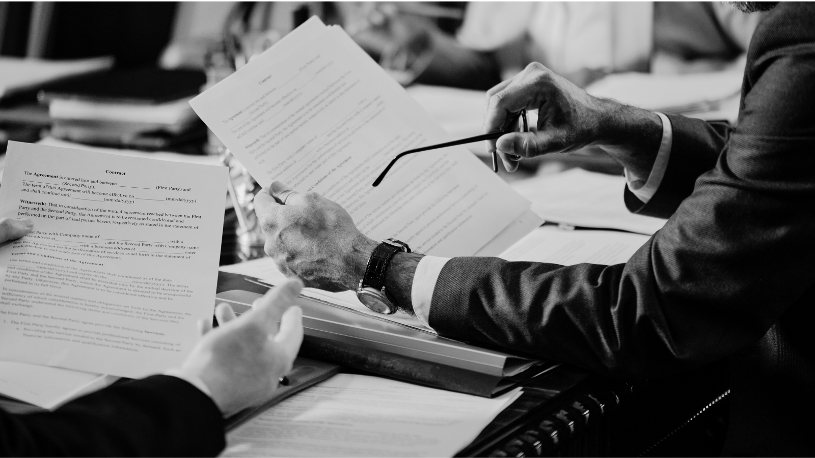 Close-up of a person reviewing a contract, representing the manual review Workday CLM and Contract Intelligence streamline